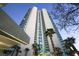 Upscale high-rise condo exterior boasting modern architecture and tropical palm trees at 322 Karen Ave # 3407, Las Vegas, NV 89109