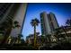 Modern high-rise condos surrounded by lush palm trees and meticulous landscaping, perfect for luxury living at 322 Karen Ave # 3407, Las Vegas, NV 89109