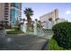 Welcoming gated entrance leading to a luxurious high-rise condominium with beautifully manicured greenery at 322 Karen Ave # 3407, Las Vegas, NV 89109