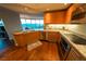 Modern kitchen featuring granite countertops, wood cabinets, and stainless steel appliances at 322 Karen Ave # 3407, Las Vegas, NV 89109