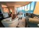 Comfortable living room featuring a curved window wall and open-concept floor plan with views of the city at 322 Karen Ave # 3407, Las Vegas, NV 89109