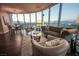 Open-concept living room with city views, wood floors, and elegant decor provides a luxurious feel to the space at 322 Karen Ave # 3407, Las Vegas, NV 89109