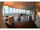 Bright living room featuring hardwood floors, contemporary furnishings, and panoramic city views at 322 Karen Ave # 3407, Las Vegas, NV 89109