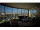 Stylish living room features floor-to-ceiling windows, showcasing a captivating city skyline and sophisticated decor at 322 Karen Ave # 3407, Las Vegas, NV 89109