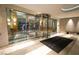 Grand lobby entrance with glass doors and elegant rug welcomes residents and guests with sophisticated style at 322 Karen Ave # 3407, Las Vegas, NV 89109