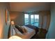 Bedroom boasting hardwood floors, comfortable bed, and balcony access with scenic city views at 322 Karen Ave # 3407, Las Vegas, NV 89109