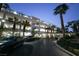 Well-maintained parking garage with ample space, complemented by lush landscaping with palm trees at 322 Karen Ave # 3407, Las Vegas, NV 89109