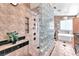 Spacious bathroom featuring a glass block shower, with a built-in shower bench and cubbies at 3609 Twinbreeze St, Las Vegas, NV 89129