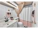 Elegant bathroom featuring a white sink, toilet, and a shower with pink accents at 3609 Twinbreeze St, Las Vegas, NV 89129