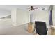 Bonus room with a ceiling fan, neutral carpeting, and a glass topped desk at 3609 Twinbreeze St, Las Vegas, NV 89129