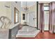 Bright foyer with tile floors, chandelier, and staircase leading to the upper level at 3609 Twinbreeze St, Las Vegas, NV 89129