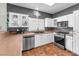Well-lit kitchen with white cabinets, stainless steel appliances, and a window offering natural light at 3609 Twinbreeze St, Las Vegas, NV 89129
