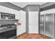 Kitchen with stainless steel appliances, microwave, and a view into the laundry room, offering convenience and functionality at 3609 Twinbreeze St, Las Vegas, NV 89129