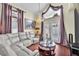 Comfortable living room with a crystal chandelier and plenty of natural light at 3609 Twinbreeze St, Las Vegas, NV 89129