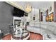 Spacious living room with modern fireplace, chandelier, and comfortable seating arrangement at 3609 Twinbreeze St, Las Vegas, NV 89129