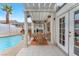 Charming outdoor patio with comfortable seating, perfect for relaxation by the pool at 3609 Twinbreeze St, Las Vegas, NV 89129