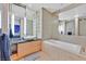Modern bathroom features a soaking tub, a marble countertop vanity, and glass-enclosed shower at 3722 Las Vegas Blvd # 2001, Las Vegas, NV 89158