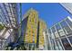 Modern high-rise building featuring a unique yellow tiled design with a glass enclosed entry and architectural detail at 3722 Las Vegas Blvd # 2001, Las Vegas, NV 89158