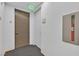 Condo hallway featuring apartment entrance with unit number, clean walls, and carpeted floor at 3722 Las Vegas Blvd # 2001, Las Vegas, NV 89158