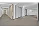 Hallway featuring elevators, clean walls, dark carpet and exit sign at 3722 Las Vegas Blvd # 2001, Las Vegas, NV 89158