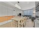 Open-concept living and dining area with modern lighting, hardwood floors, and city views at 3722 Las Vegas Blvd # 2001, Las Vegas, NV 89158