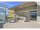 Stylish outdoor lounge area with modern seating, an outdoor clock, and views of the city skyline at 3722 Las Vegas Blvd # 2001, Las Vegas, NV 89158