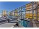 Luxurious rooftop pool with city views, modern lounge chairs, and clear blue skies at 3722 Las Vegas Blvd # 2001, Las Vegas, NV 89158