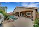 Expansive backyard with a pool, spa, covered patio, and lush landscaping, ideal for outdoor living at 3723 Robin Knot Ct, North Las Vegas, NV 89084