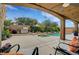 Outdoor kitchen, pool, and spa with covered patio make this backyard perfect for entertaining at 3723 Robin Knot Ct, North Las Vegas, NV 89084