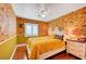 Charming bedroom featuring bright floral wallpaper, hardwood floors, and a cozy atmosphere for restful nights at 3723 Robin Knot Ct, North Las Vegas, NV 89084