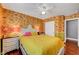 Bright bedroom featuring eye-catching wall paper, hardwood floors, and ample natural light at 3723 Robin Knot Ct, North Las Vegas, NV 89084