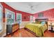 Charming bedroom with a ceiling fan, plantation shutters and wood-look flooring at 3723 Robin Knot Ct, North Las Vegas, NV 89084