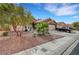 Beautiful single-story home with desert landscaping, low-maintenance rock garden, and two-car garage at 3723 Robin Knot Ct, North Las Vegas, NV 89084