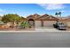 Charming single-story home with a well-maintained yard, desert landscaping, and a two-car garage at 3723 Robin Knot Ct, North Las Vegas, NV 89084