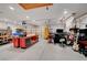Spacious garage with ample room for parking and storage, enhanced with a workbench and storage solutions at 3723 Robin Knot Ct, North Las Vegas, NV 89084