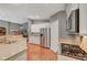 Well-equipped kitchen with stainless steel appliances, granite countertops, and adjacent eating area, ideal for cooking and dining at 3723 Robin Knot Ct, North Las Vegas, NV 89084