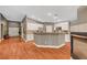 This open kitchen has stainless steel appliances, white cabinetry, and a large center island at 3723 Robin Knot Ct, North Las Vegas, NV 89084
