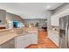 Bright kitchen featuring white cabinets, stainless steel appliances, and an open layout to adjacent living areas at 3723 Robin Knot Ct, North Las Vegas, NV 89084