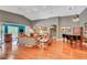 Spacious living room featuring hardwood floors, vaulted ceilings, a piano, and many art pieces, creating a vibrant atmosphere at 3723 Robin Knot Ct, North Las Vegas, NV 89084