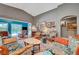 Comfortable living room with hardwood floors, cozy furniture, vaulted ceilings, and access to the backyard at 3723 Robin Knot Ct, North Las Vegas, NV 89084