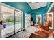 Serene living room with comfortable seating and a seamless transition to an outdoor pool and patio area at 3723 Robin Knot Ct, North Las Vegas, NV 89084