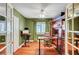 Inviting home office with built-in shelving, hardwood floors, and bright windows, creating a functional and stylish workspace at 3723 Robin Knot Ct, North Las Vegas, NV 89084