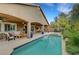 Backyard pool with spa, covered patio area, and mature landscaping, creating a serene outdoor retreat at 3723 Robin Knot Ct, North Las Vegas, NV 89084