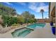 Beautiful pool and spa with lush landscaping in a private backyard setting at 3723 Robin Knot Ct, North Las Vegas, NV 89084