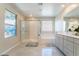 Bright bathroom featuring a shower, a tub, and modern fixtures and finishes at 397 American Dipper St, Las Vegas, NV 89138