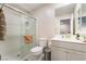Bright bathroom with a white vanity, a shower with glass doors, and neutral walls at 397 American Dipper St, Las Vegas, NV 89138