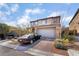 Stunning two-story home featuring a desert landscape and a spacious two-car garage at 397 American Dipper St, Las Vegas, NV 89138