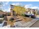 Inviting two-story home boasting a desert landscape, brick steps, and a two-car garage at 397 American Dipper St, Las Vegas, NV 89138