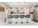 Modern kitchen featuring a large island, stainless steel appliances, and stylish pendant lighting at 397 American Dipper St, Las Vegas, NV 89138