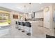 Bright kitchen with an island bar and barstool seating open to the outdoor patio area at 397 American Dipper St, Las Vegas, NV 89138